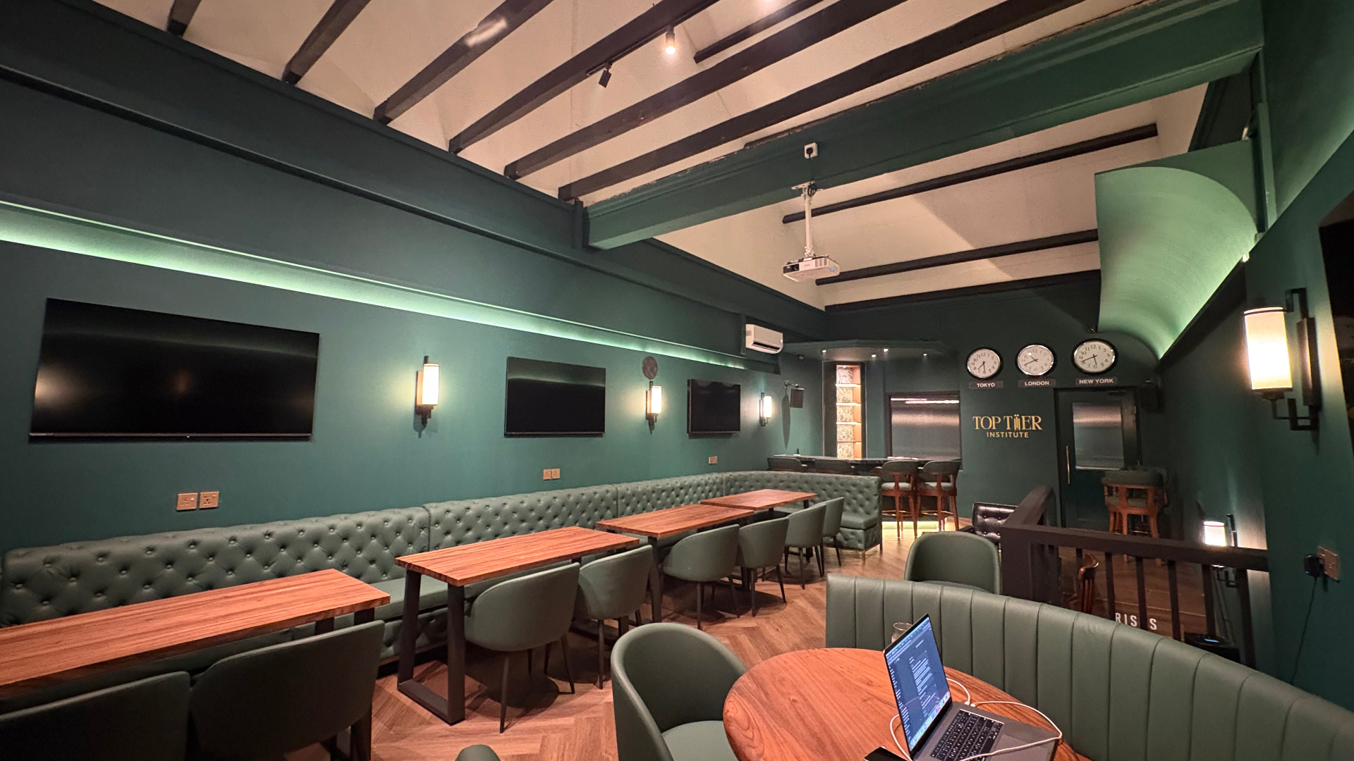 TopTier Institute trading space — main floor with screens